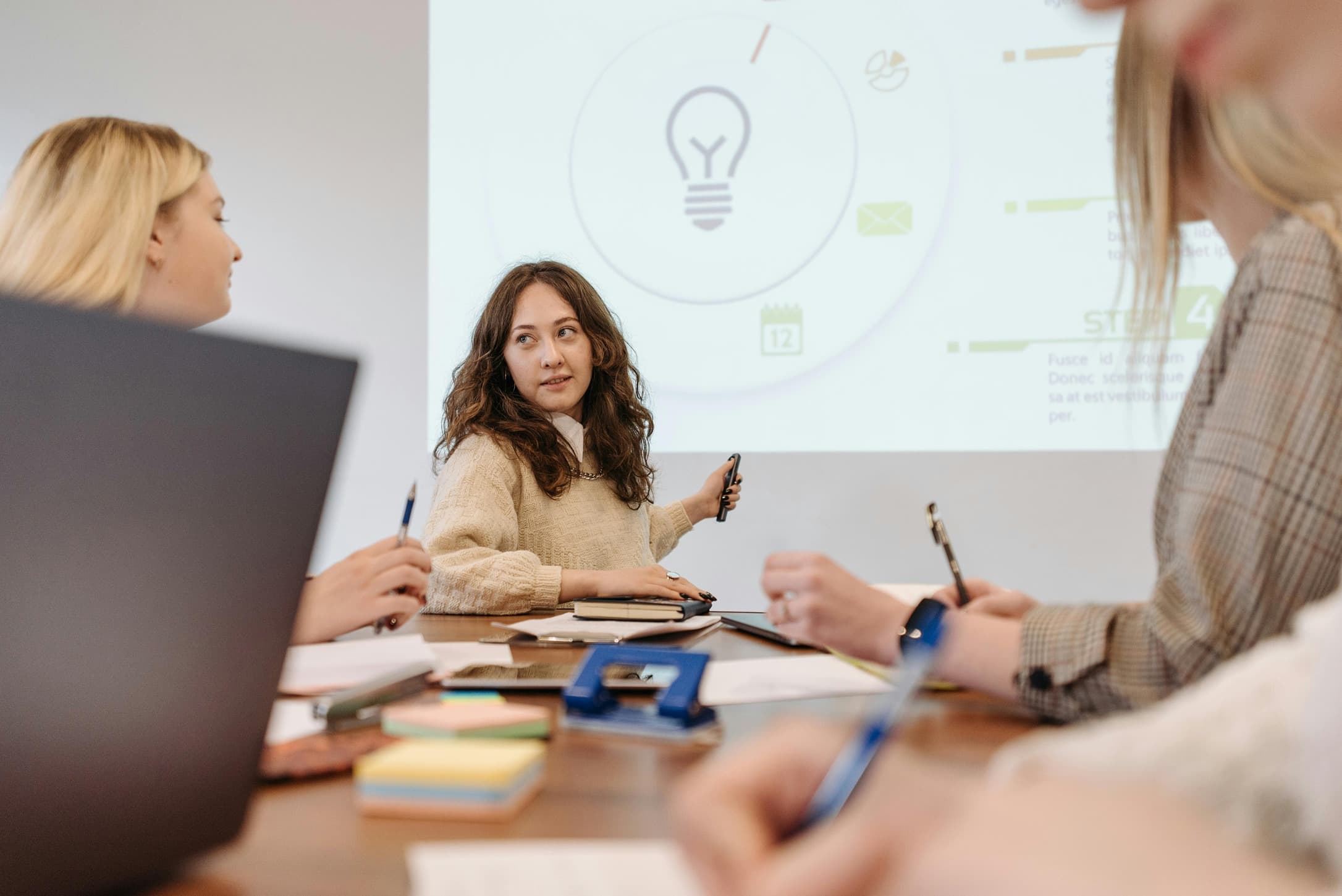 Team ideation meeting with three professionals discussing IT skills strategy